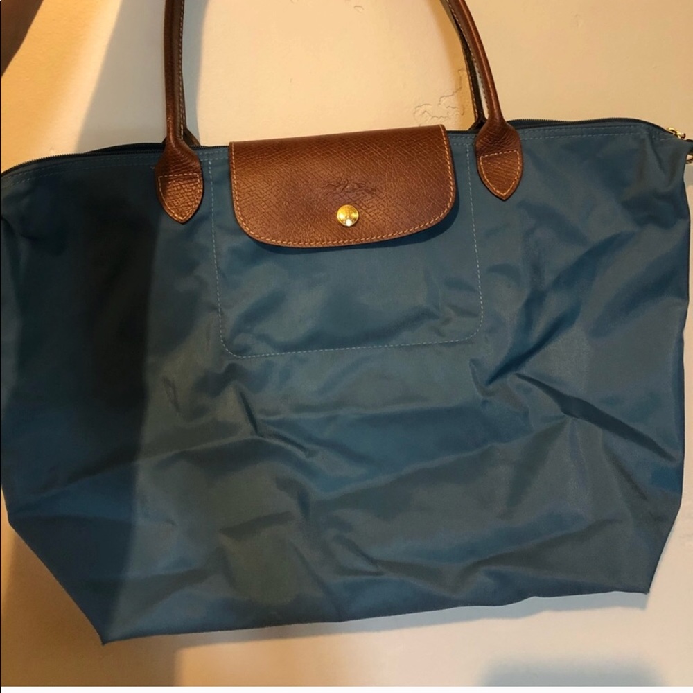 Long champ medium sized petrol blue bag.